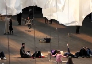 People on swings at event of a thread