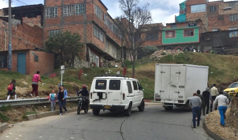 Dangerous hilly road with cars and pedestrians, Ciudad Bolivar, Bogota